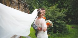 Long veil on a windy day, orange and grey theme, windy wedding, rainy day wedding