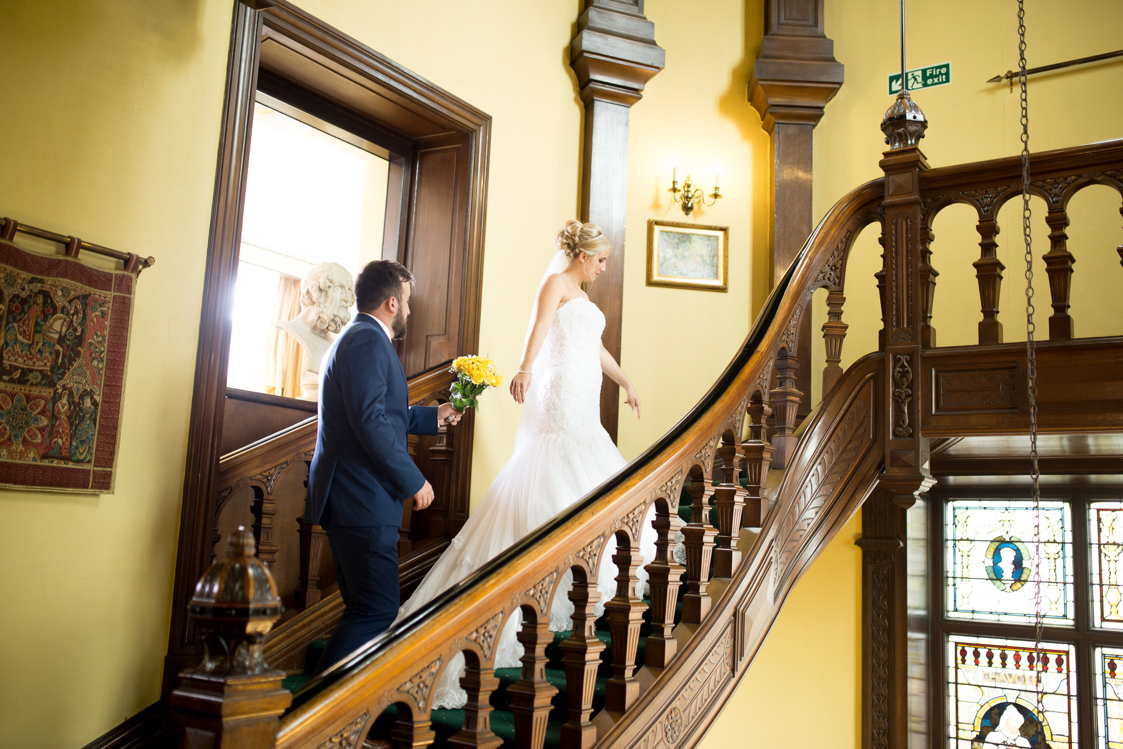 Bride and Groom up the stairs to the venue
