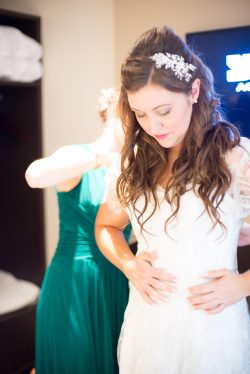 Bride getting into her dress