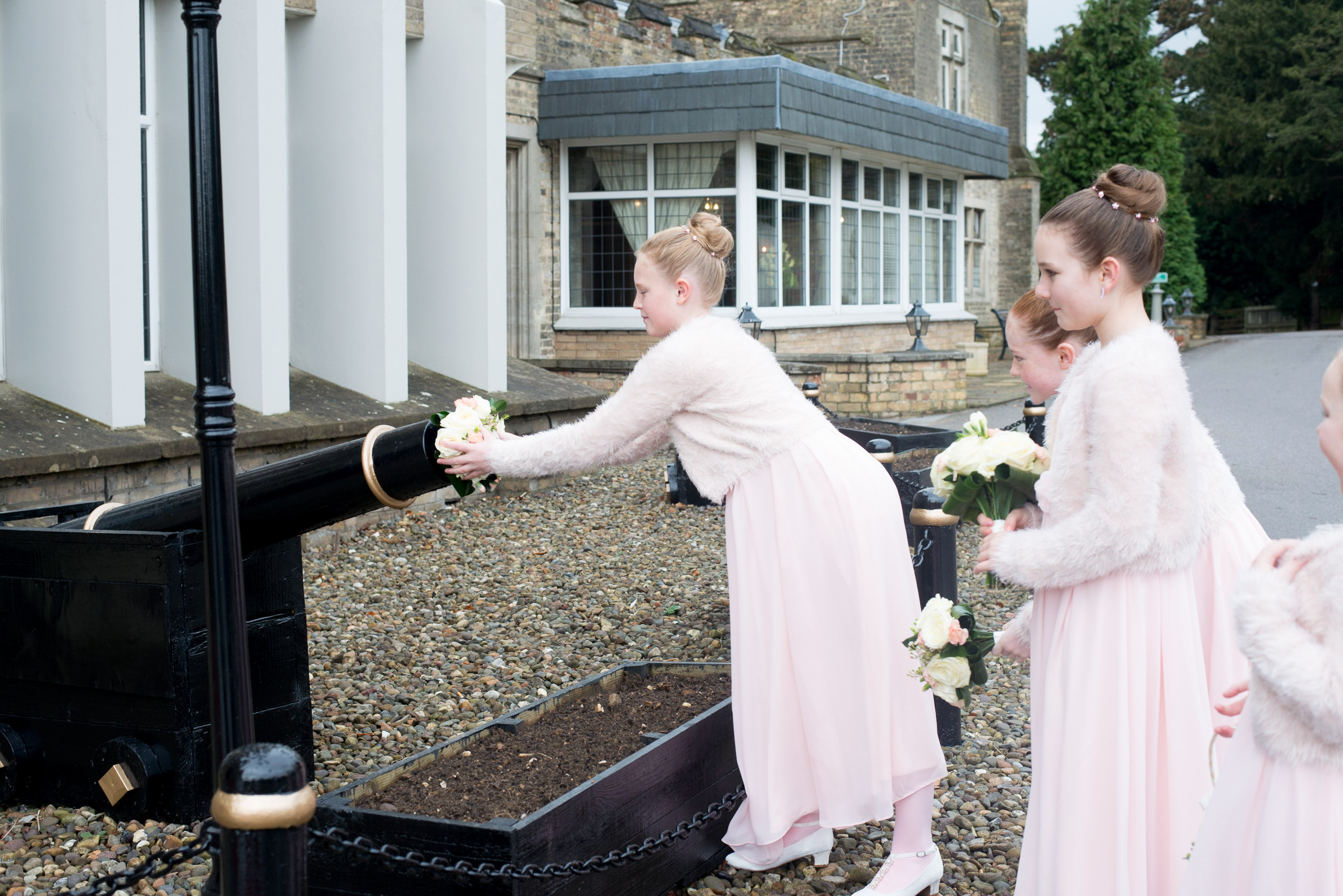 Bridesmaids playing with the cannon