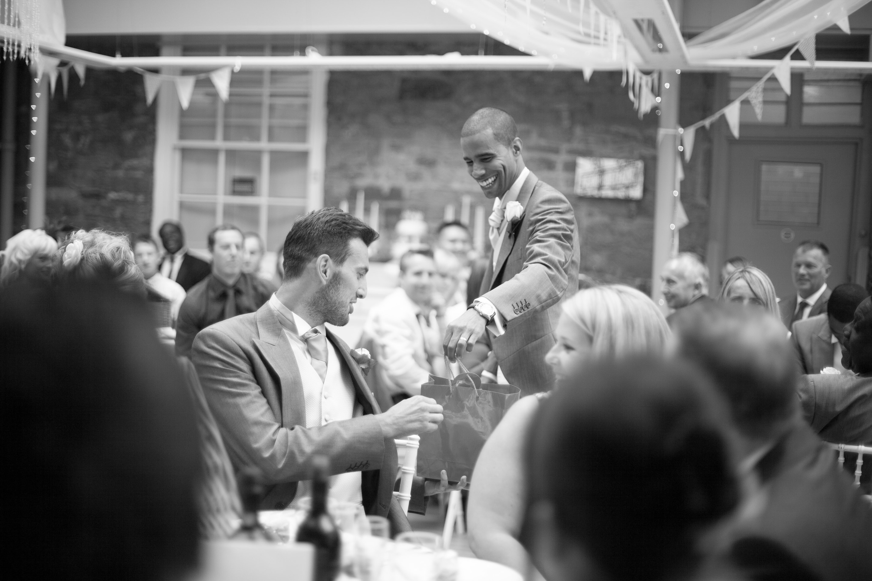 Groom gives gifts during speech