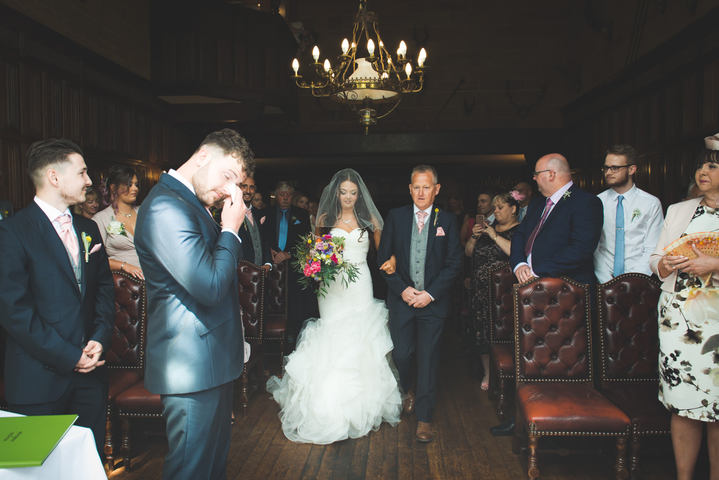 a tear for the groom, walking down the aisle, wedding photography