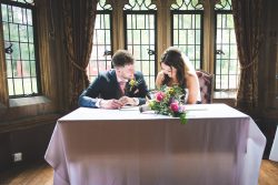 Signing the register, the realisation that they are now married, love is in the air, wedding photography