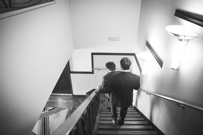 Groomsmen in stairwell
