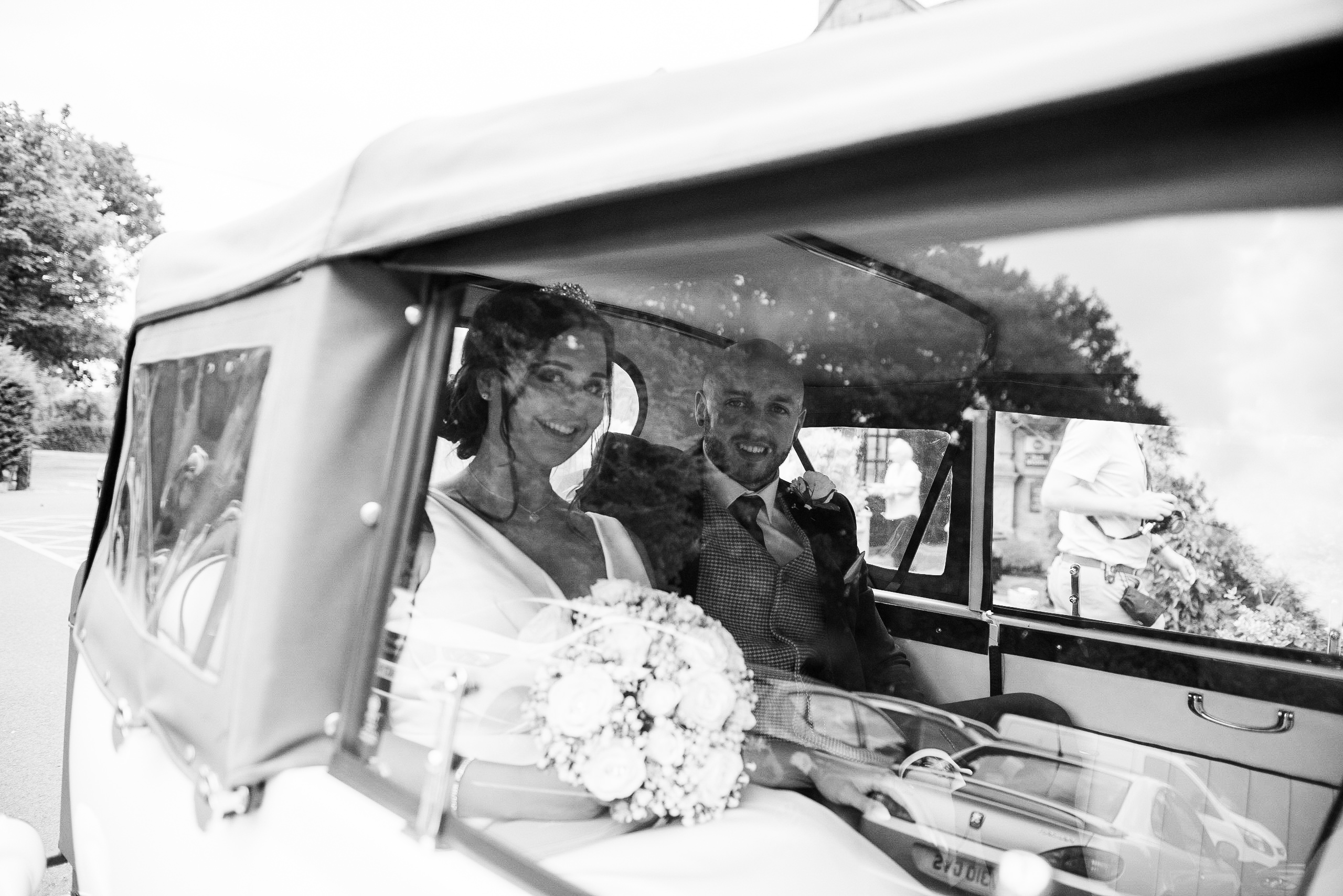 Bride and groom in bridal car